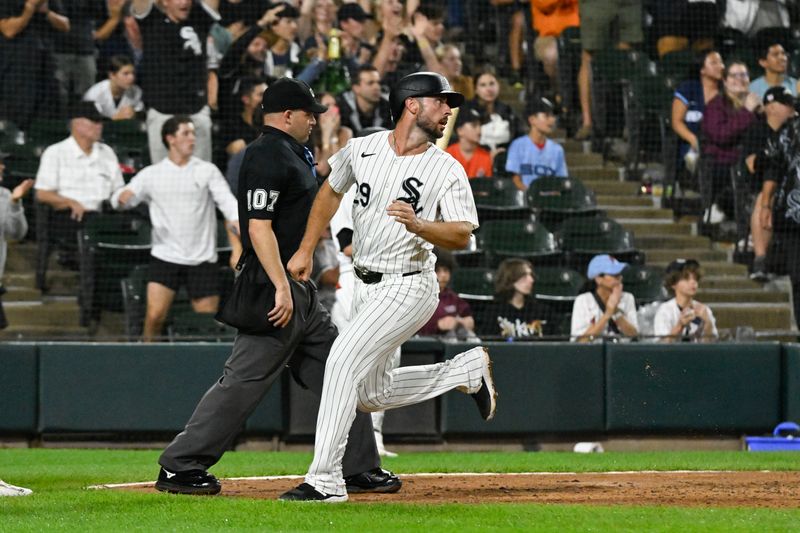 Jun 27, 2024; Chicago, Illinois, USA;  Chicago White Sox shortstop Paul DeJong (29) scores during the sixth inning against the Colorado Rockies at Guaranteed Rate Field. Mandatory Credit: Matt Marton-USA TODAY Sports