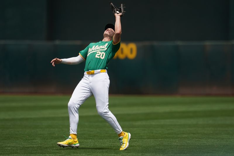 Jun 8, 2024; Oakland, California, USA; Oakland Athletics second baseman Zack Gelof (20) catches a fly ball against the Toronto Blue Jays in the second inning at Oakland-Alameda County Coliseum. Mandatory Credit: Cary Edmondson-USA TODAY Sports