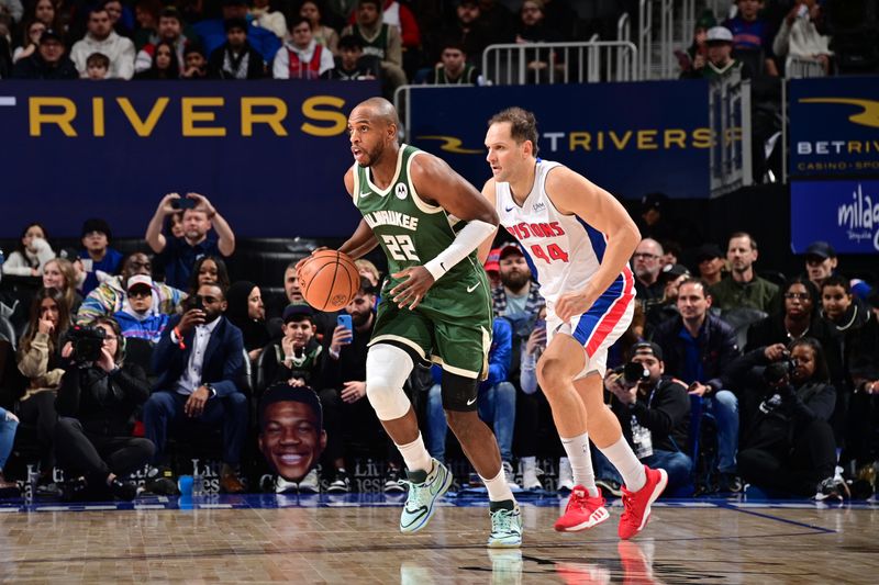 DETROIT, MI - JANUARY 22: Khris Middleton #22 of the Milwaukee Bucks brings the ball up court against the Detroit Pistons on January 22, 2024 at Little Caesars Arena in Detroit, Michigan. NOTE TO USER: User expressly acknowledges and agrees that, by downloading and/or using this photograph, User is consenting to the terms and conditions of the Getty Images License Agreement. Mandatory Copyright Notice: Copyright 2024 NBAE (Photo by Chris Schwegler/NBAE via Getty Images)