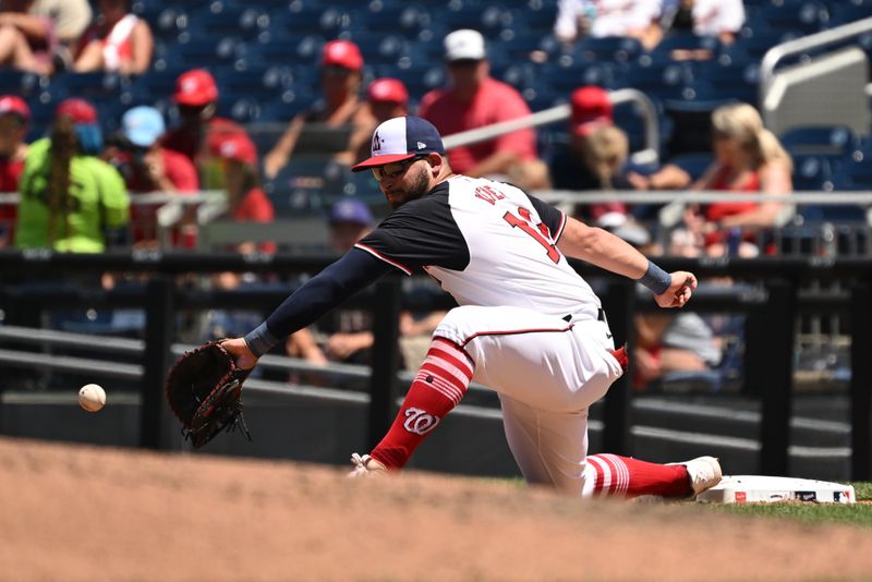 Jul 7, 2024; Washington, District of Columbia, USA; Washington Nationals left fielder Juan Yepez (18) catches the ball at first base for an out against the St. Louis Cardinals during the fourth inning at Nationals Park. Mandatory Credit: Rafael Suanes-USA TODAY Sports