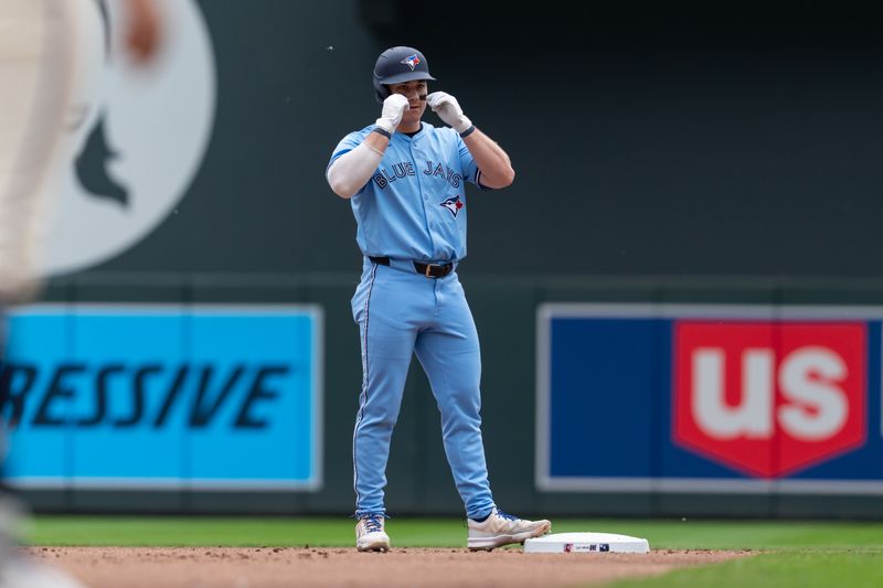 Jun 8, 2025; Minneapolis, Minnesota, USA; Toronto Blue Jays left fielder Alan Roden (18) reacts to hitting a RBI double during the second inning against the Minnesota Twins at Target Field. Mandatory Credit: Jordan Johnson-Imagn Images