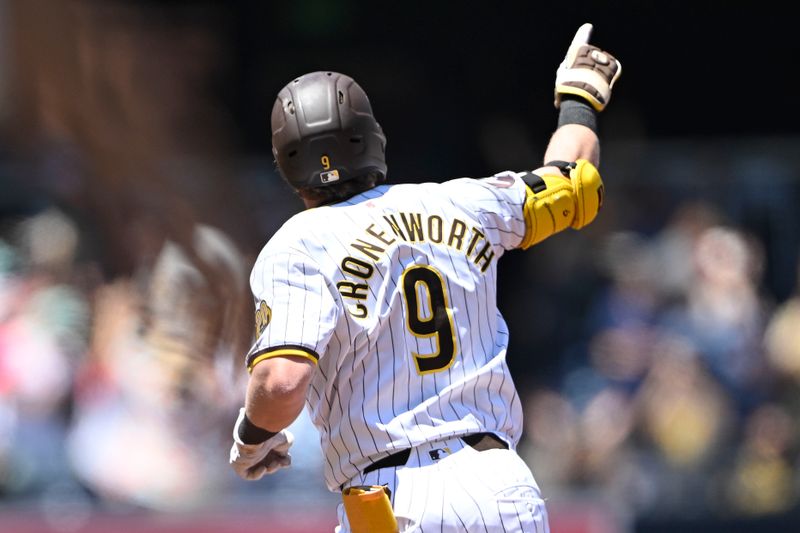 August 14, 2024; San Diego, California, USA; San Diego Padres first baseman Jake Cronenworth (9) rounds the bases after hitting a three run home run against the Pittsburgh Pirates during the first inning at Petco Park. Mandatory Credit: Denis Poroy-USA TODAY Sports at Petco Park. 