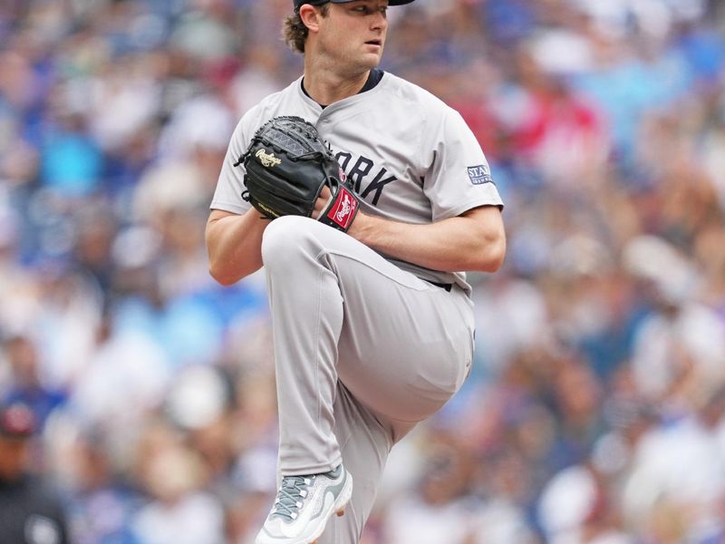 Jun 30, 2024; Toronto, Ontario, CAN; New York Yankees starting pitcher Gerrit Cole (45) throws a pitch against the Toronto Blue Jays during the first inning at Rogers Centre. Mandatory Credit: Nick Turchiaro-USA TODAY Sports