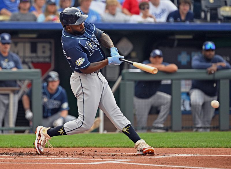 Jul 15, 2023; Kansas City, Missouri, USA;  Tampa Bay Rays left fielder Randy Arozarena (56) singles against the Kansas City Royals in the first inning at Kauffman Stadium. Mandatory Credit: Peter Aiken-USA TODAY Sports