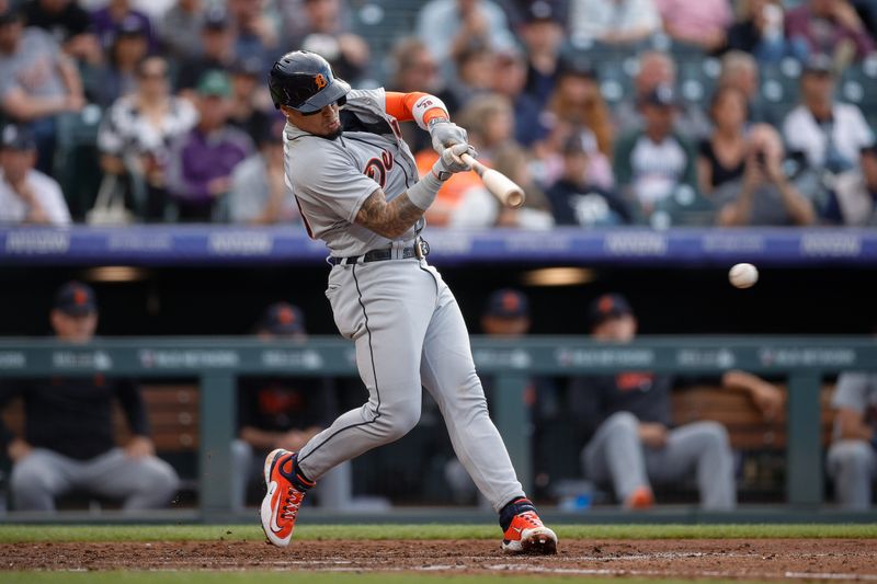 Jun 30, 2023; Denver, Colorado, USA; Detroit Tigers shortstop Javier Baez (28) hits a single in the fourth inning against the Colorado Rockies at Coors Field. Mandatory Credit: Isaiah J. Downing-USA TODAY Sports