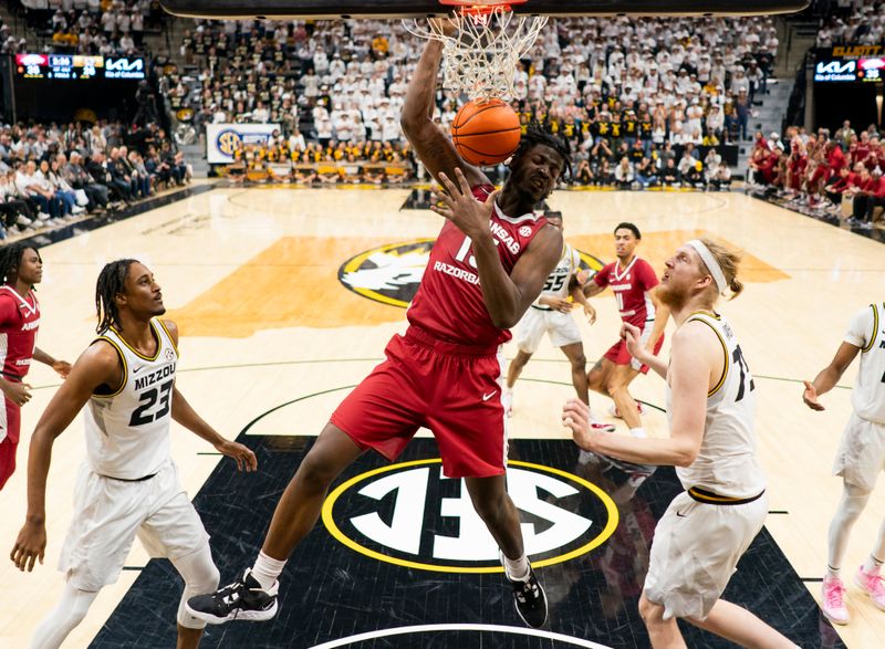 Jan 31, 2024; Columbia, Missouri, USA; Arkansas Razorbacks forward Makhi Mitchell (15) dunks the ball against the Missouri Tigers during the first half at Mizzou Arena. Mandatory Credit: Jay Biggerstaff-USA TODAY Sports