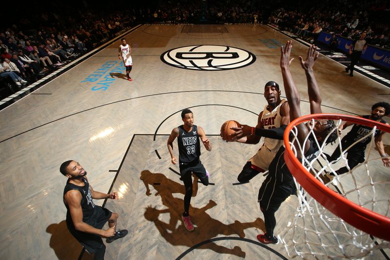 BROOKLYN, NY - JANUARY 15: Bam Adebayo #13 of the Miami Heat drives to the basket during the game against the Brooklyn Nets on January 15, 2024 at Barclays Center in Brooklyn, New York. NOTE TO USER: User expressly acknowledges and agrees that, by downloading and or using this Photograph, user is consenting to the terms and conditions of the Getty Images License Agreement. Mandatory Copyright Notice: Copyright 2024 NBAE (Photo by Nathaniel S. Butler/NBAE via Getty Images)