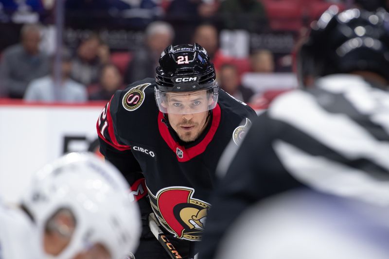 Sep 24, 2024; Ottawa, Ontario, CAN; Ottawa Senato right wing Nick Cousins (21) lines up for a faceoff in the first period against the Toronto Maple Leafs at the Canadian Tire Centre. Mandatory Credit: Marc DesRosiers-Imagn Images