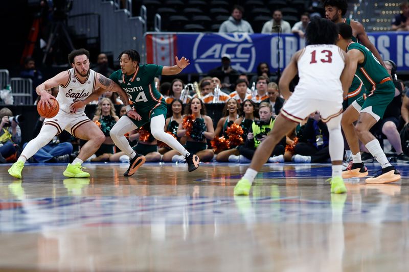 Mar 12, 2024; Washington, D.C., USA; Boston College Eagles guard Jaeden Zackery (3) dribbles the ball as Miami (Fl) Hurricanes guard Nijel Pack (24) defends in the first half at Capital One Arena. Mandatory Credit: Geoff Burke-USA TODAY Sports