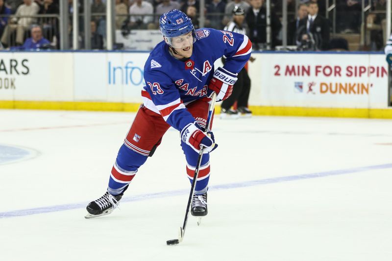 Oct 23, 2025; New York, New York, USA;  New York Rangers defenseman Adam Fox (23) prepares for a shot on goal attempt in the first period against the San Jose Sharks at Madison Square Garden. Mandatory Credit: Wendell Cruz-Imagn Images