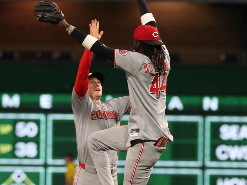 May 19, 2025; Pittsburgh, Pennsylvania, USA;  Cincinnati Reds left fielder Austin Hays (left) and shortstop Elly De La Cruz (44) celebrate after defeating the Pittsburgh Pirates at PNC Park. Mandatory Credit: Charles LeClaire-Imagn Images