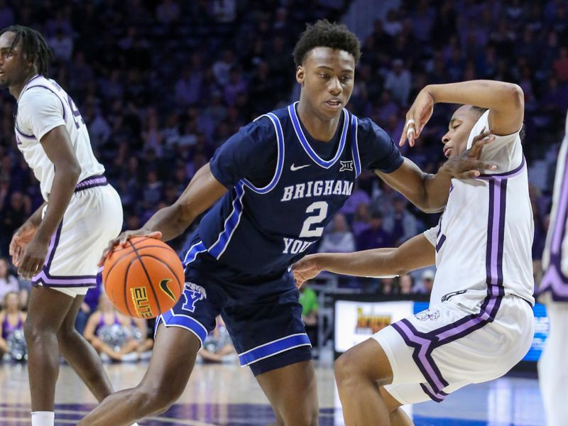 Feb 24, 2024; Manhattan, Kansas, USA; Brigham Young Cougars guard Jaxson Robinson (2) dribbles against Kansas State Wildcats guard Tylor Perry (2) during the second half at Bramlage Coliseum. Mandatory Credit: Scott Sewell-USA TODAY Sports