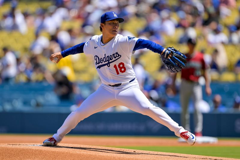 Aug 31, 2025; Los Angeles, California, USA; Los Angeles Dodgers starting pitcher Yoshinobu Yamamoto (18) pitches during the first inning at Dodger Stadium. Mandatory Credit: Jayne Kamin-Oncea-Imagn Images