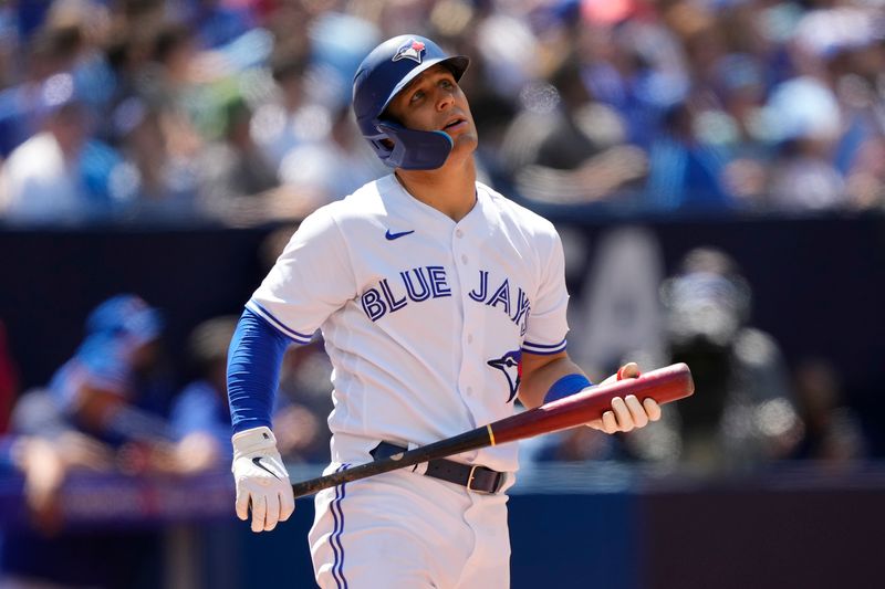 Jul 30, 2023; Toronto, Ontario, CAN; Toronto Blue Jays center fielder Daulton Varsho (25) reacts after a foul ball against the Los Angeles Angels during the ninth inning at Rogers Centre. Mandatory Credit: John E. Sokolowski-USA TODAY Sports