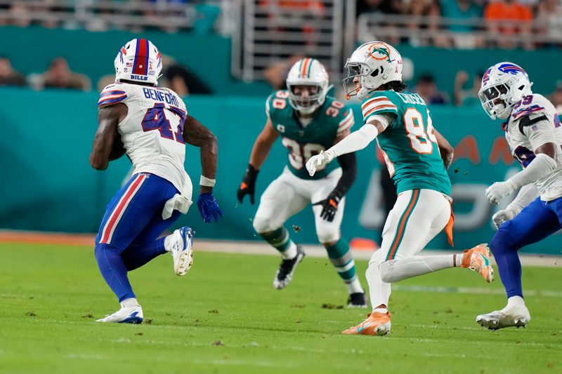 Buffalo Bills cornerback Christian Benford (47) intercepts a pass intended for Miami Dolphins wide receiver Robbie Chosen (84) during the first half of an NFL football game, Thursday, Sept. 12, 2024, in Miami Gardens, Fla. (AP Photo/Lynne Sladky)