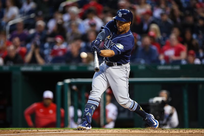 Apr 3, 2023; Washington, District of Columbia, USA; Tampa Bay Rays catcher Francisco Mejia (21) hits a sacrifice fly during the second inning against the Washington Nationals at Nationals Park. Mandatory Credit: Scott Taetsch-USA TODAY Sports