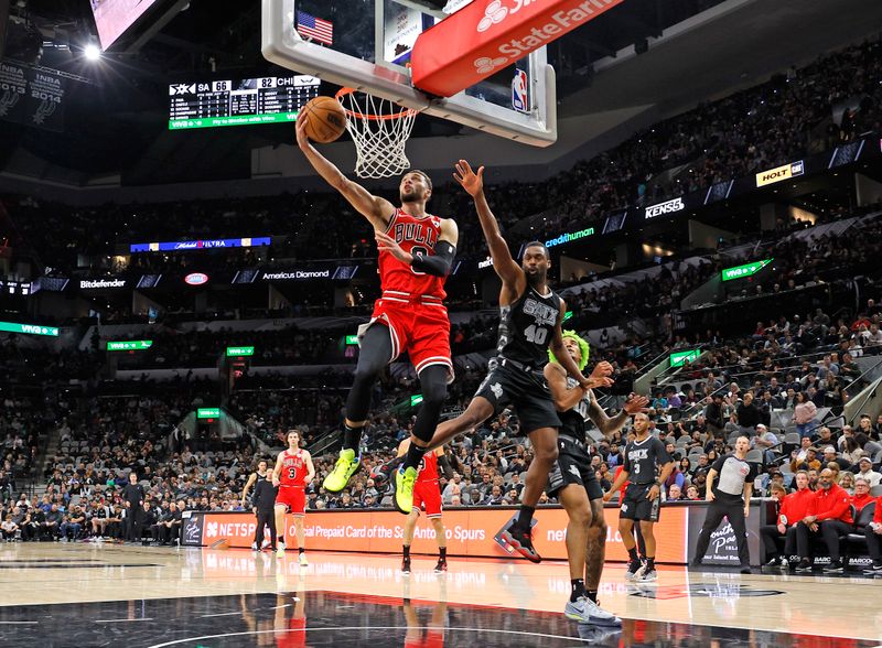 SAN ANTONIO, TX - DECEMBER 5:  Zach LaVine #8 of the Chicago Bulls scores against Harrison Barnes #40 of the San Antonio Spurs n the second half at Frost Bank Center on December 5, 2024 in San Antonio, Texas. NOTE TO USER: User expressly acknowledges and agrees that, by downloading and or using this photograph, User is consenting to terms and conditions of the Getty Images License Agreement. (Photo by Ronald Cortes/Getty Images)