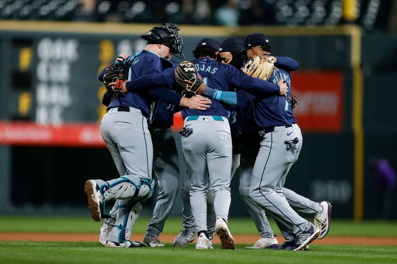 Apr 20, 2024; Denver, Colorado, USA; Seattle Mariners players celebrate after the game against the Colorado Rockies at Coors Field. Mandatory Credit: Isaiah J. Downing-USA TODAY Sports