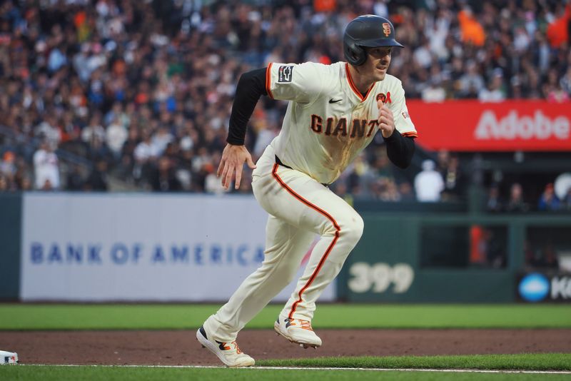 Jul 31, 2024; San Francisco, California, USA; San Francisco Giants right fielder Mike Yastrzemski (5) runs home on a sacrifice fly against the Oakland Athletics during the fifth inning at Oracle Park. Mandatory Credit: Kelley L Cox-USA TODAY Sports