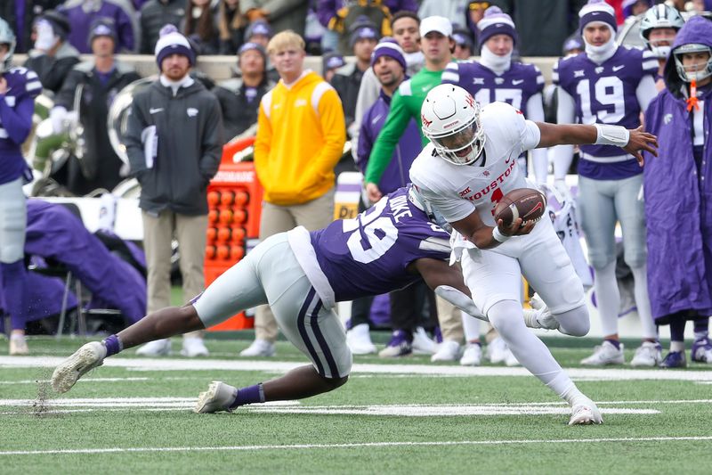 Oct 28, 2023; Manhattan, Kansas, USA; Houston Cougars quarterback Donovan Smith (1) tries to get away from Kansas State Wildcats defensive end Khalid Duke (29) during the second quarter at Bill Snyder Family Football Stadium. Mandatory Credit: Scott Sewell-USA TODAY Sports