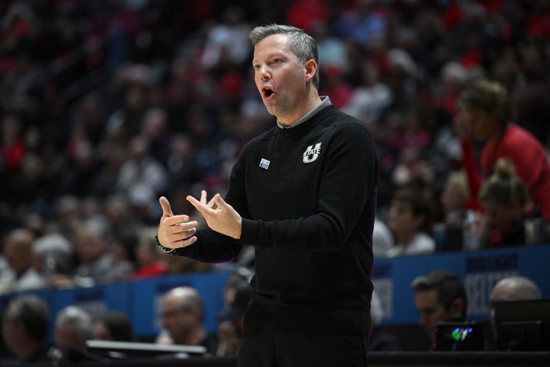 Jan 25, 2023; San Diego, California, USA; Utah State Aggies head coach Ryan Odom gestures from the sideline during the first half against the San Diego State Aztecs at Viejas Arena. Mandatory Credit: Orlando Ramirez-USA TODAY Sports