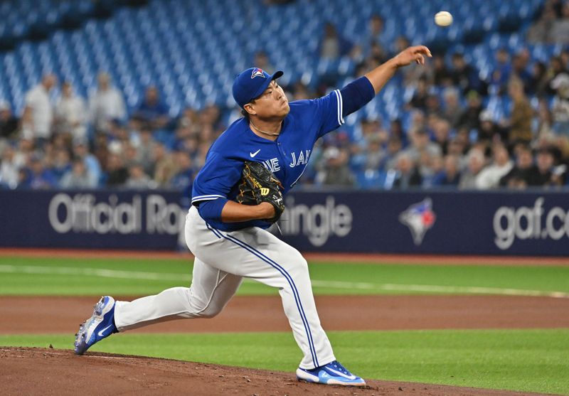 Sep 12, 2023; Toronto, Ontario, CAN;   Toronto Blue Jays starting pitcher Hyun Jin Ryu (99) delivers a pitch against the Texas Rangers in the first inning at Rogers Centre. Mandatory Credit: Dan Hamilton-USA TODAY Sports