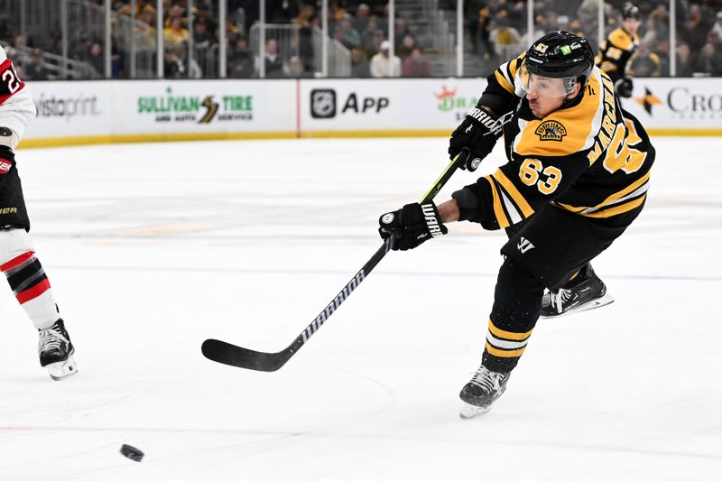 Jan 23, 2025; Boston, Massachusetts, USA; Boston Bruins left wing Brad Marchand (63) takes a shot against the Ottawa Senators during the first period at the TD Garden. Mandatory Credit: Brian Fluharty-Imagn Images