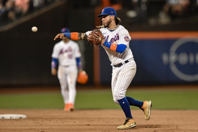 Aug 9, 2023; New York City, New York, USA; New York Mets second baseman Jonathan Arauz (19) fields a ground ball and throws to first base for an out during the sixth inning against the Chicago Cubs at Citi Field. Mandatory Credit: John Jones-USA TODAY Sports