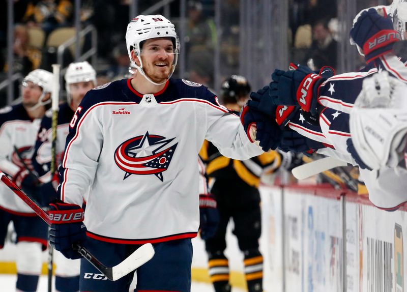 Mar 5, 2024; Pittsburgh, Pennsylvania, USA; Columbus Blue Jackets center Jack Roslovic (96) celebrates with the Blue Jackets bench after scoring a goal against the Pittsburgh Penguins during the third period at PPG Paints Arena. The Penguins won 5-3. Mandatory Credit: Charles LeClaire-USA TODAY Sports