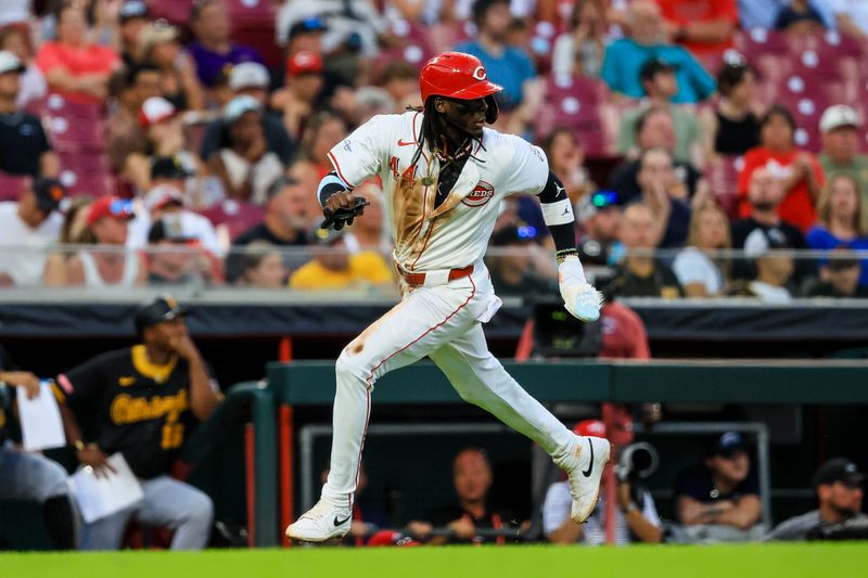 Jun 24, 2024; Cincinnati, Ohio, USA; Cincinnati Reds shortstop Elly De La Cruz (44) scores on a RBI single hit by outfielder Spencer Steer (not pictured) in the fifth inning against the Pittsburgh Pirates at Great American Ball Park. Mandatory Credit: Katie Stratman-USA TODAY Sports