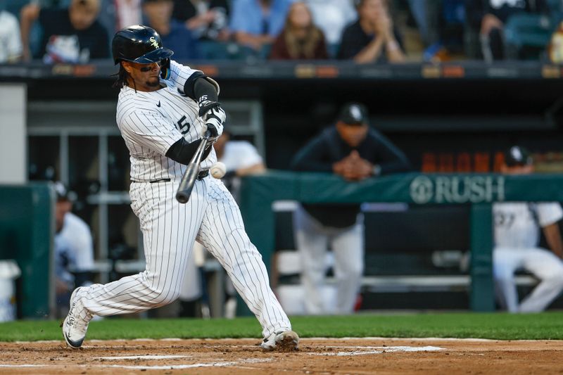 Apr 30, 2024; Chicago, Illinois, USA; Chicago White Sox catcher Martín Maldonado (15) singles against the Minnesota Twins during the third inning at Guaranteed Rate Field. Mandatory Credit: Kamil Krzaczynski-USA TODAY Sports