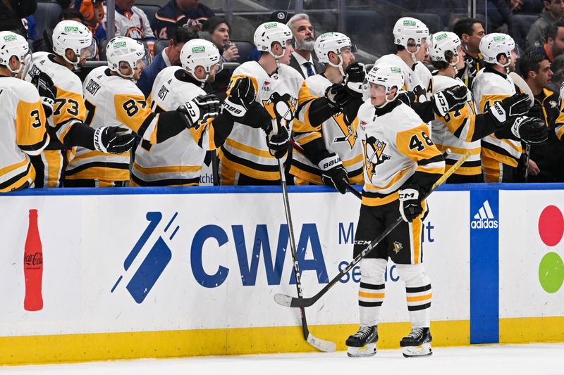 Apr 17, 2024; Elmont, New York, USA;  Pittsburgh Penguins right wing Valtteri Puustinen (48) celebrates his goal against the New York Islanders during the second period at UBS Arena. Mandatory Credit: Dennis Schneidler-USA TODAY Sports