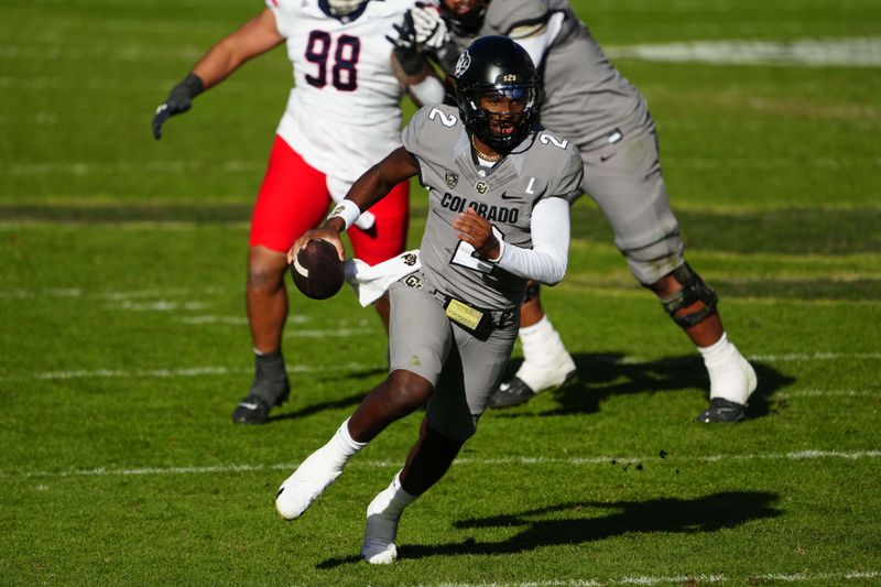 Nov 11, 2023; Boulder, Colorado, USA; Colorado Buffaloes quarterback Shedeur Sanders (2) carries the ball in the second half against the Arizona Wildcats at Folsom Field. Mandatory Credit: Ron Chenoy-USA TODAY Sports