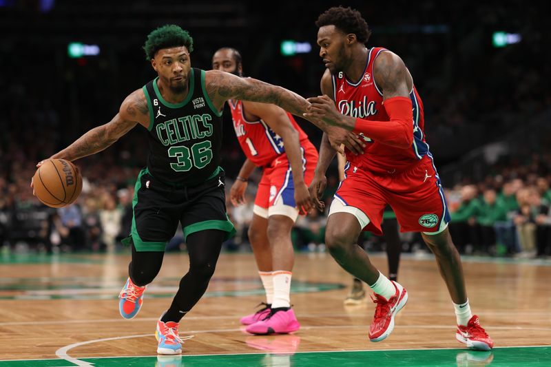 BOSTON, MASSACHUSETTS - MAY 01: Marcus Smart #36 of the Boston Celtics dribbles against Paul Reed #44 of the Philadelphia 76ers during the second half in game one of the Eastern Conference Second Round Playoffs  at TD Garden on May 01, 2023 in Boston, Massachusetts. NOTE TO USER: User expressly acknowledges and agrees that, by downloading and or using this photograph, User is consenting to the terms and conditions of the Getty Images License Agreement.  (Photo by Maddie Meyer/Getty Images)