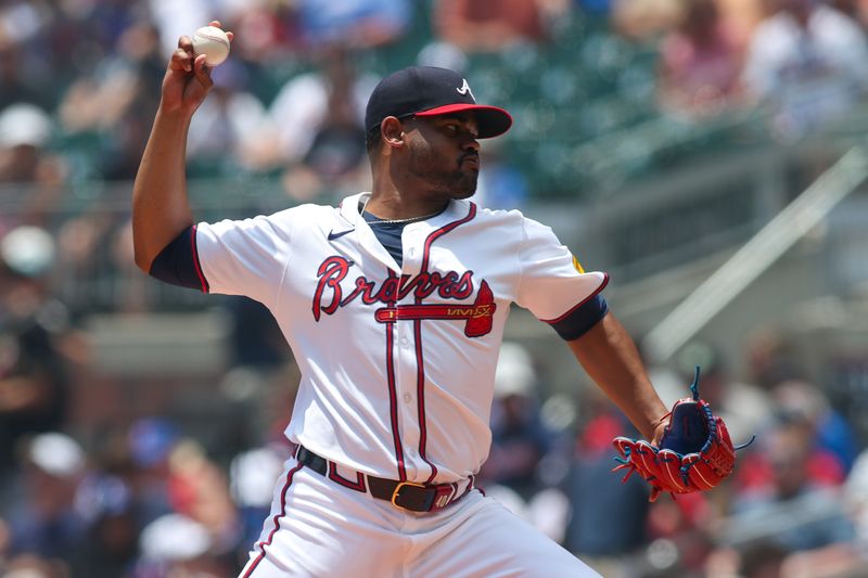 Jul 7, 2024; Atlanta, Georgia, USA; Atlanta Braves pitcher Reynaldo Lopez (40) throws against the Philadelphia Phillies in the first inning at Truist Park. Mandatory Credit: Brett Davis-USA TODAY Sports
