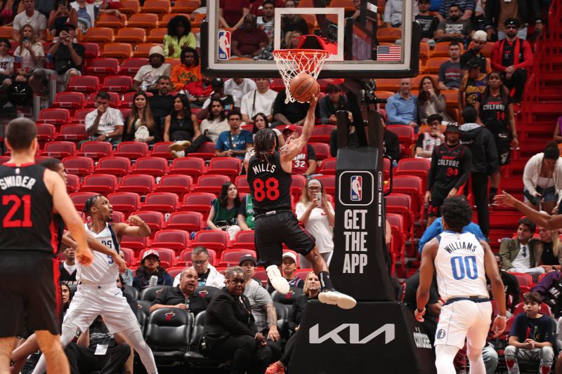 MIAMI, FL - APRIL 10: Patty Mills #88 of the Miami Heat  shoots the ball during the game against the Dallas Mavericks  on April 10, 2024 at Kaseya Center in Miami, Florida. NOTE TO USER: User expressly acknowledges and agrees that, by downloading and or using this Photograph, user is consenting to the terms and conditions of the Getty Images License Agreement. Mandatory Copyright Notice: Copyright 2024 NBAE (Photo by Issac Baldizon/NBAE via Getty Images)