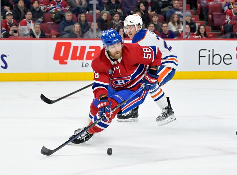 Jan 13, 2024; Montreal, Quebec, CAN; Montreal Canadiens defenseman David Savard (58) plays the puck during the first period of the game against the Edmonton Oilers at the Bell Centre. Mandatory Credit: Eric Bolte-USA TODAY Sports