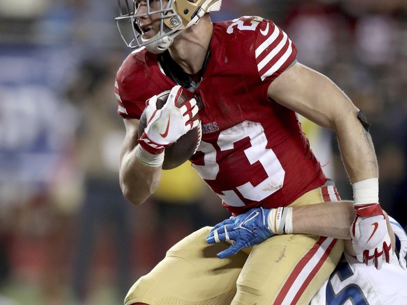 San Francisco 49ers running back Christian McCaffrey (23) scores during the NFC Championship NFL football game against the Detroit Lions in Santa Clara, Calif., Sunday, Jan. 28, 2024. (AP Photo/Scot Tucker)