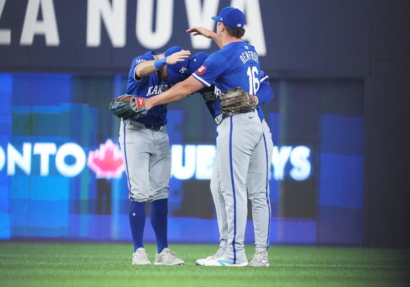 May 1, 2024; Toronto, Ontario, CAN; Kansas City Royals left fielder Garrett Hampson (2), centre fielder Kyle Isbel (28), and right fielder Hunter Renfroe (16) celebrate the win against the Toronto Blue Jays at the end of the ninth inning at Rogers Centre. Mandatory Credit: Nick Turchiaro-USA TODAY Sports