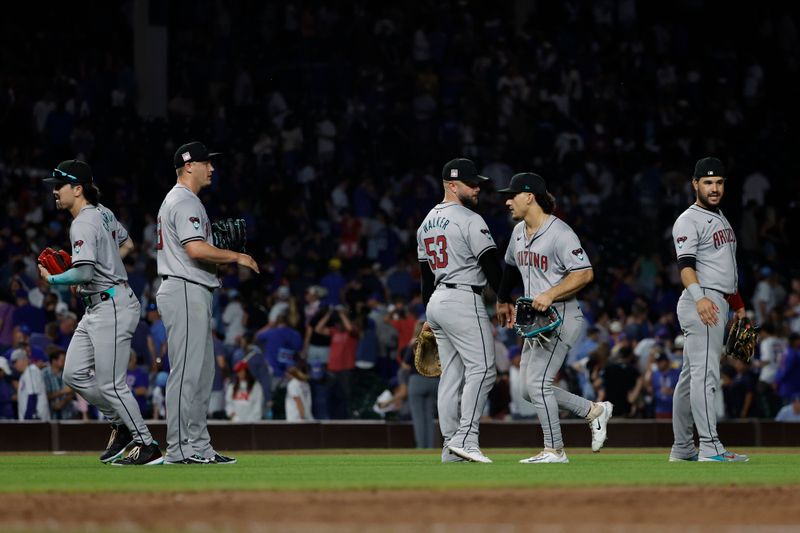 Jul 20, 2024; Chicago, Illinois, USA; Arizona Diamondbacks players celebrate after defeating the Chicago Cubs at Wrigley Field. Mandatory Credit: Kamil Krzaczynski-USA TODAY Sports