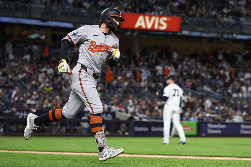 Sep 24, 2024; Bronx, New York, USA; Baltimore Orioles left fielder Colton Cowser (17) hits a solo home run during the eighth inning against the New York Yankees at Yankee Stadium. Mandatory Credit: Vincent Carchietta-Imagn Images