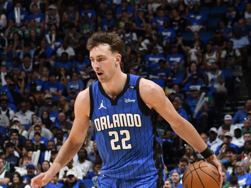 ORLANDO, FL - APRIL 27:  Franz Wagner #22 of the Orlando Magic dribbles the ball during the game against the Boston Celtics  during Round 1 Game 4 of the 2025 NBA Playoffs on April 27, 2025 at Kia Center in Orlando, Florida. NOTE TO USER: User expressly acknowledges and agrees that, by downloading and or using this photograph, User is consenting to the terms and conditions of the Getty Images License Agreement. Mandatory Copyright Notice: Copyright 2025 NBAE (Photo by Fernando Medina/NBAE via Getty Images)