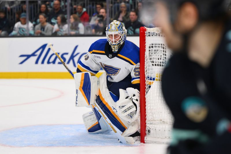 Jan 26, 2024; Seattle, Washington, USA; St. Louis Blues goaltender Jordan Binnington (50) defends the goal against the Seattle Kraken during the second period at Climate Pledge Arena. Mandatory Credit: Steven Bisig-USA TODAY Sports