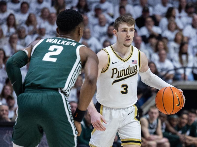 Jan 29, 2023; West Lafayette, Indiana, USA;  Purdue Boilermakers guard Braden Smith (3) dribbles the ball while Michigan State Spartans guard Tyson Walker (2) defends in the second half at Mackey Arena. Mandatory Credit: Trevor Ruszkowski-USA TODAY Sports