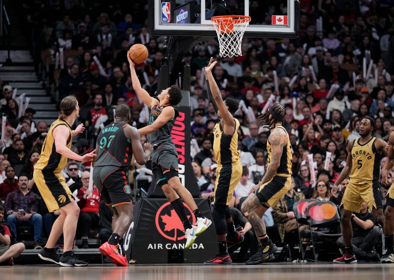 TORONTO, ON - APRIL 7: Jordan Poole #13 of the Washington Wizards goes to the basket against the Toronto Raptors during the second half of their basketball game at the Scotiabank Arena on April 7, 2024 in Toronto, Ontario, Canada. NOTE TO USER: User expressly acknowledges and agrees that, by downloading and/or using this Photograph, user is consenting to the terms and conditions of the Getty Images License Agreement. (Photo by Mark Blinch/Getty Images)
