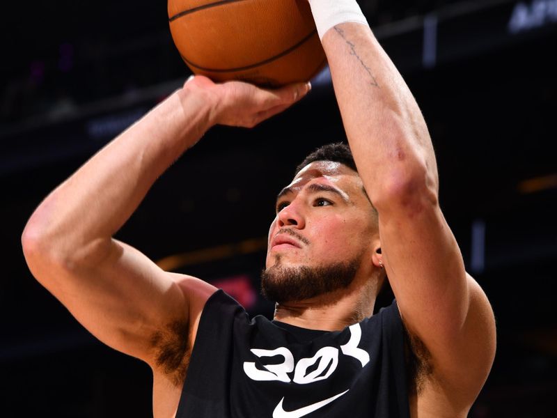 PHOENIX, AZ - FEBRUARY 27: Devin Booker #1 of the Phoenix Suns warms up before the game against the New Orleans Pelicans on February 27, 2025 at PHX Arena in Phoenix, Arizona. NOTE TO USER: User expressly acknowledges and agrees that, by downloading and or using this photograph, user is consenting to the terms and conditions of the Getty Images License Agreement. Mandatory Copyright Notice: Copyright 2025 NBAE (Photo by Barry Gossage/NBAE via Getty Images)