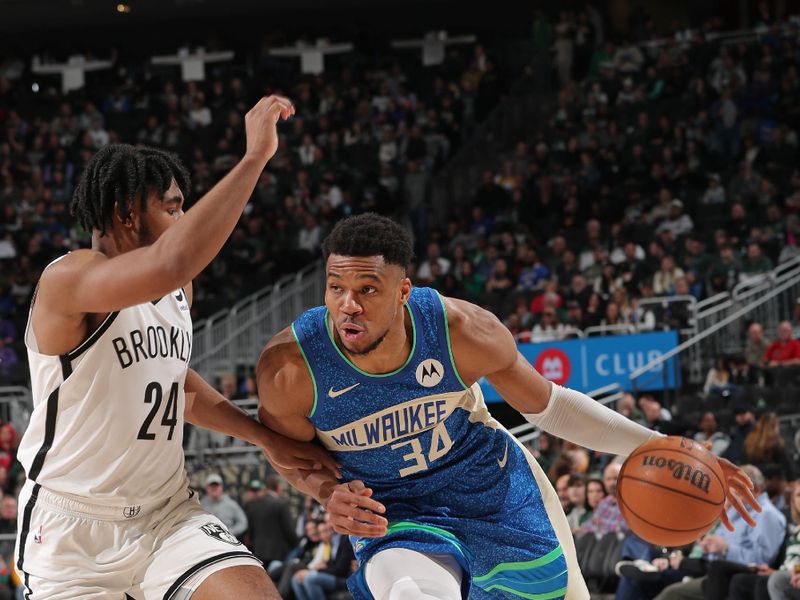 MILWAUKEE, WI - MARCH 21: Giannis Antetokounmpo #34 of the Milwaukee Bucks handles the ball during the game against the Brooklyn Nets on March 21, 2024 at the Fiserv Forum Center in Milwaukee, Wisconsin. NOTE TO USER: User expressly acknowledges and agrees that, by downloading and or using this Photograph, user is consenting to the terms and conditions of the Getty Images License Agreement. Mandatory Copyright Notice: Copyright 2024 NBAE (Photo by Gary Dineen/NBAE via Getty Images).