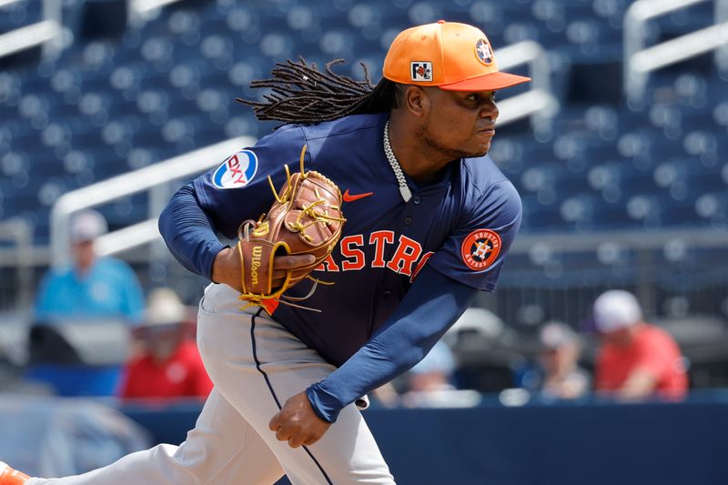 Feb 26, 2025; West Palm Beach, Florida, USA; Houston Astros pitcher Framber Valdez (59) throws a warmup pitch before the first inning against the Washington Nationals at CACTI Park of the Palm Beaches. Mandatory Credit: Reinhold Matay-Imagn Images