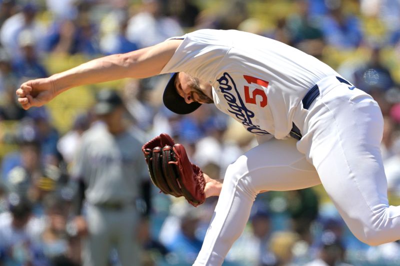 Apr 30, 2025; Los Angeles, California, USA;  Los Angeles Dodgers relief pitcher Alex Vesia (51) delivers to the plate in the seventh inning against the Miami Marlins at Dodger Stadium. Mandatory Credit: Jayne Kamin-Oncea-Imagn Images