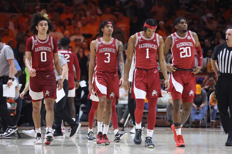 Feb 28, 2023; Knoxville, Tennessee, USA; Arkansas Razorbacks guard Anthony Black (0), guard Nick Smith Jr. (3), guard Ricky Council IV (1) and forward Kamani Johnson (20) during the second half against the Tennessee Volunteers at Thompson-Boling Arena. Mandatory Credit: Randy Sartin-USA TODAY Sports